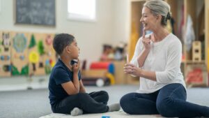 RBT explaining what is ABA therapy to young boy