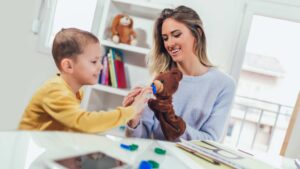 ABA Professional teaching a kid understanding autism