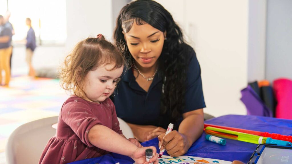 ABA professional working with a little girl with autism